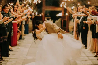 Bride walking down the aisle with confetti
